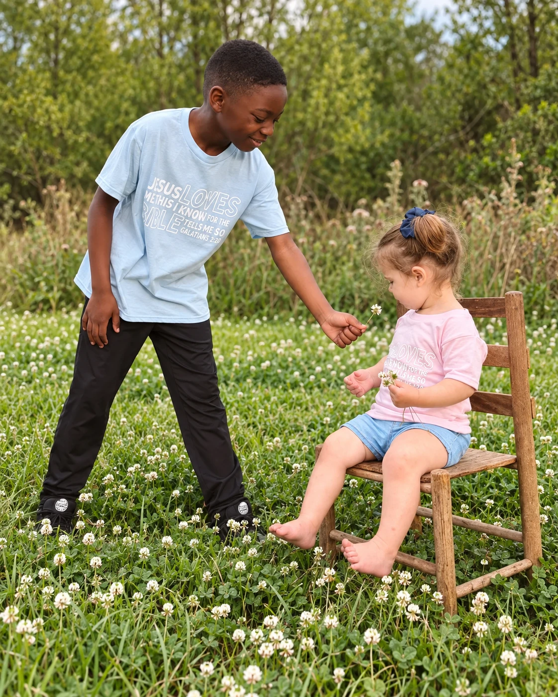 Two children sharing a moment outdoors in CROWND apparel
