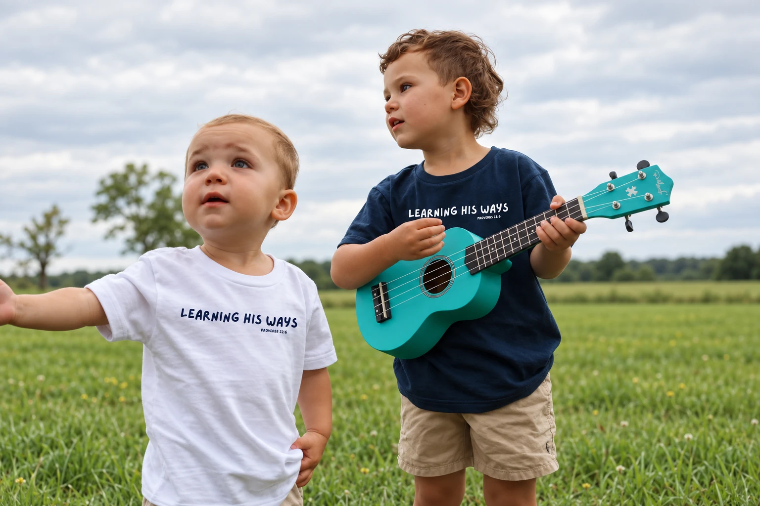 Two children wearing Learning His Ways tees and playing with a ukulele